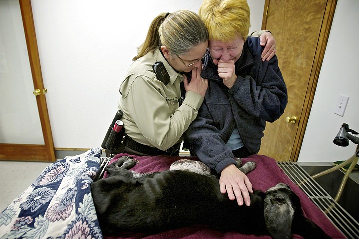 &lt;p&gt;Karen Williams, a Kootenai County Sheriff animal control officer, comforts Jean Curran who cries over the dog she found Tuesday in the Riverside Harbor subdivision in Post Falls. Curran took the dog to Hayden Pet Medical Center where it had to be euthanized due to its condition.&lt;/p&gt;