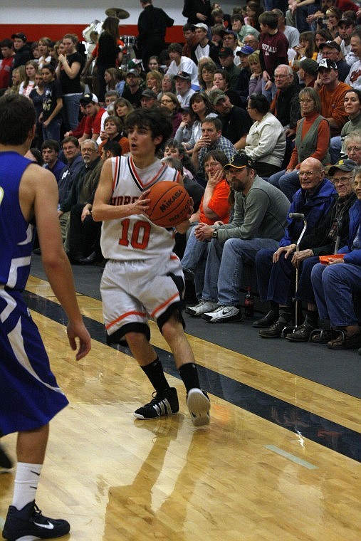 Junior guard Brandyn Smith is cornered between a Bluehawk and the sideline during Friday's 40-59 loss against Thompson Falls.