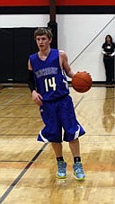 Senior guard Josh Hojem handles the ball during a 59-40 Bluehawks win over Rival Plains on Friday.