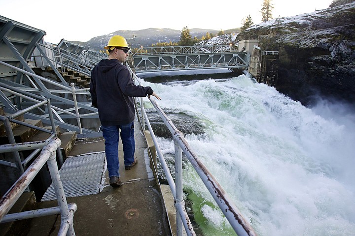 &lt;p&gt;LaRoy Dowd, Post Falls dam manager for Avista, walks above the spillway Wednesday where an estimated 12,000 cubic feet of water per second&lt;/p&gt;