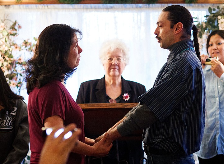 &lt;p&gt;Jeremy Coleman, of Plummer, recites his vows to his bride Elena Ambro as they are married by minister LaVena Allen Wednesday at the Hitching Post Wedding Chapel in Coeur d'Alene. Kootenai County has proposed a $20 increase in marriage licenses to help fund legal help in civil matters.&lt;/p&gt;