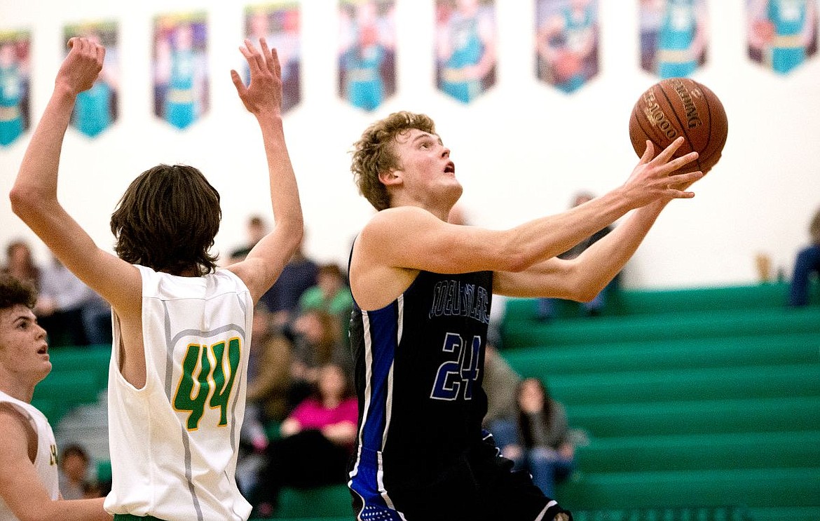 &lt;p&gt;JAKE PARRISH/Press Coeur d'Alene's Joey Naccarato sights the basket as he shoots past Lakeland's Holden Ray (44) on Tuesday at Lakeland High School.&lt;/p&gt;