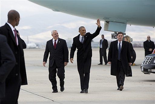 &lt;p&gt;President Barack Obama walks on the tarmac with Boise Mayor David Bieter after arriving on Air Force One, Wednesday at Gowen Field Air National Guard Base in Boise , Idaho, en route to Boise State University where he will discuss the themes in his State of the Union address. (AP Photo/Carolyn Kaster)&lt;/p&gt;