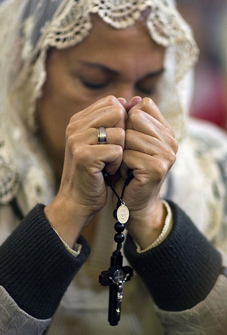 &lt;p&gt;A woman prays during a Mass in honor of the late Pope Juan Pablo II where a reliquary of his blood is on display at the Cathedral in Bogota, Colombia, Friday. The silver reliquary of blood taken from John Paul II during his last hospitalization before his death in 2005, arrived in Bogota on Thursday night on a flight from Rome, where it will return on Monday.&lt;/p&gt;