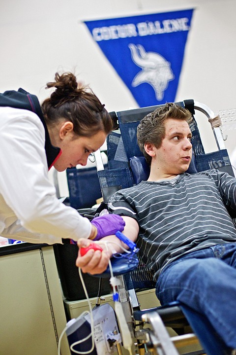 &lt;p&gt;JEROME A. POLLOS/Press Nick Pratt, 16, a Coeur d'Alene High student and first-time blood donor,&Ecirc;looks away as Honey Huste, a phlebotomist&Ecirc; with the Inland Northwest Blood Center inserts a needle into his vein Thursday during the school's blood drive. The Inland Northwest Blood Center is hoping to receive 315 units of blood to increase its supply due to low donations caused by the cold and flu season as well as transportation issues related to weather. The blood drive will continue today from 8 a.m. until 4 p.m. and Coeur d'Alene High and is open to the public for donations.&lt;/p&gt;