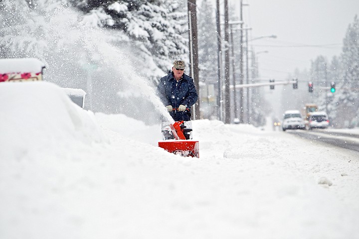 &lt;p&gt;JEROME A. POLLOS/Press Dale Ruperd clears out the snow in front of his mailbox along 15th Street in Coeur d'Alene so the postman can deliver the mail Friday.&lt;/p&gt;