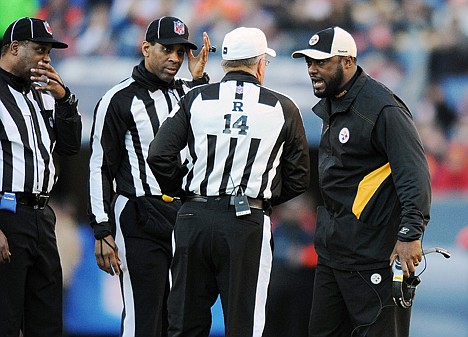 &lt;p&gt;Pittsburgh Steelers coach Mike Tomlin talks with the referees during an NFL wild card playoff football game Jan. 8 against the Denver Broncos in Denver. Thanks to a handful of attention-getting calls in this year's playoffs, the officiating is a topic of conversation.&lt;/p&gt;