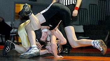 Flathead's Dan Jenkins dominates Big Sky's Zach Schweitzer Tuesday evening at Flathead in a 145-pound match. Jenkins won by technical fall, 16-0. Flathead shut out Big Sky. Karen Nichols/Daily Inter Lake