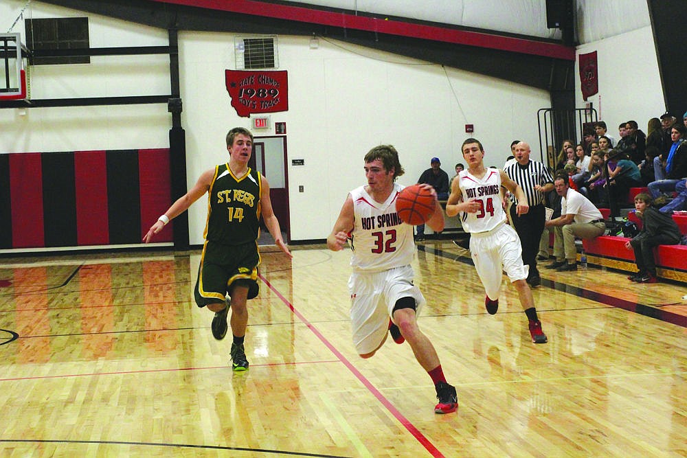 &lt;p&gt;Nate Gray, of the Hot Springs Savage Heat heads towards the basket against St. Regis last week.&lt;/p&gt;