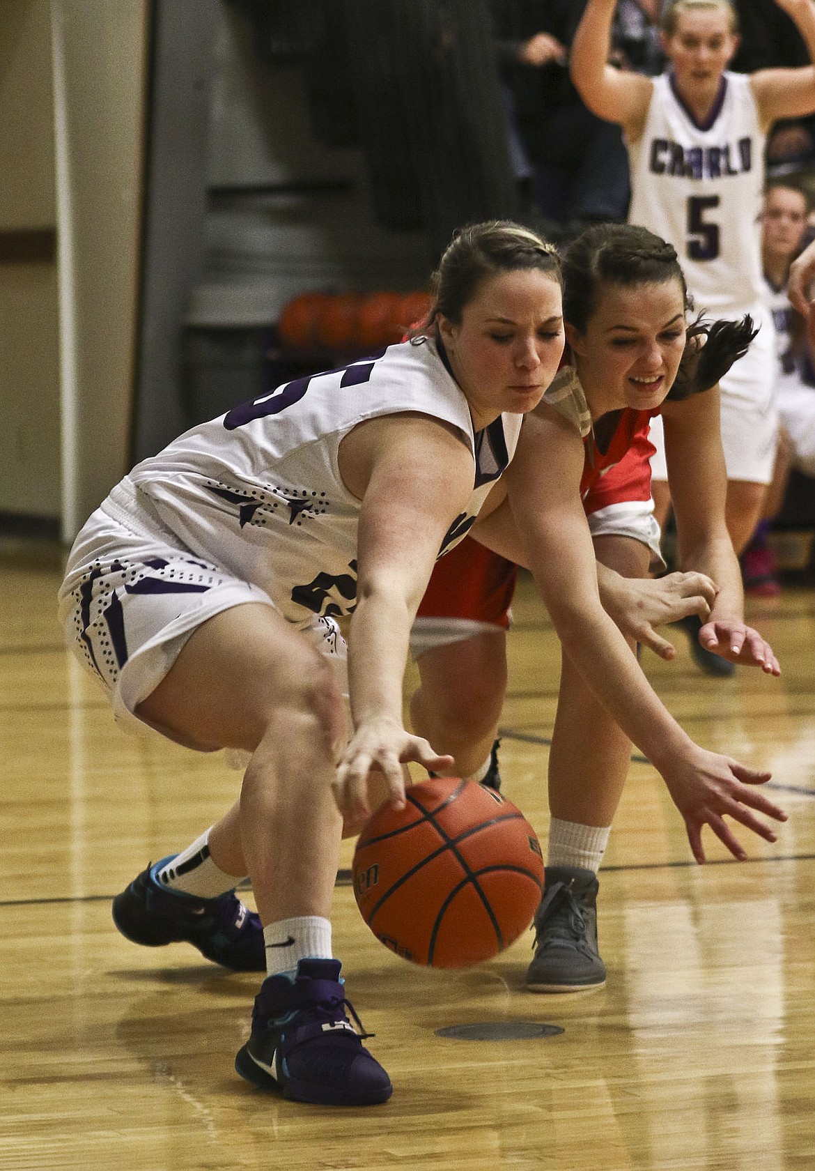 &lt;p&gt;Charlo's Sakoya Gaustad and Arlee's Megan Shick fight for possession of the ball during their game Thursday night in Charlo.&lt;/p&gt;