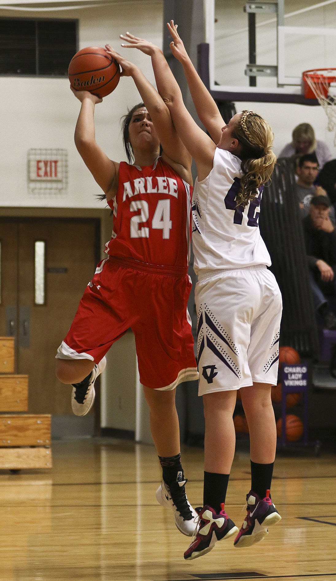 &lt;p&gt;Arlee's Alyssia Vanderburg goes up for a shot over Charlo's Skyler Frame Thursday night in Charlo.&lt;/p&gt;