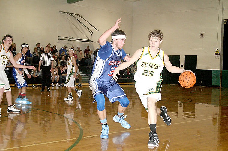 &lt;p&gt;Superior junior Wyatt Zylawy attempts to block junior Gibson Lowry, of St. Regis, during the rivalry game Tuesday in St. Regis.&lt;/p&gt;