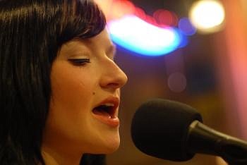 Bettreena Jaeger, 20, of Betty and the Boy, sings an original tune Monday night with Josh Harvey, not pictured, at Colter Coffee House in Kalispell. Garrett Cheen/Daily Inter Lake