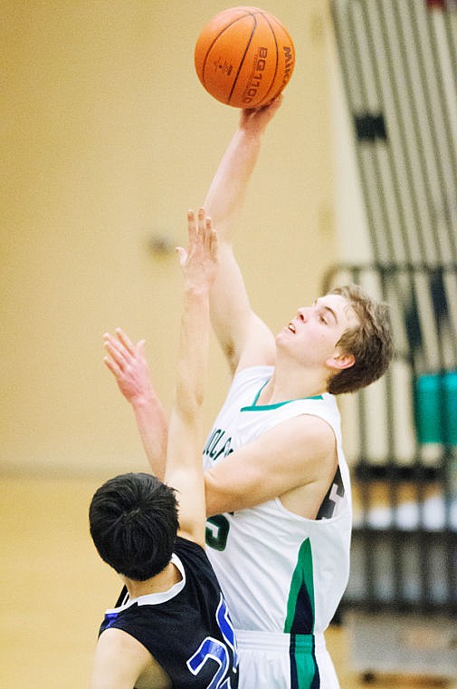 &lt;p&gt;Glacier's Kevin Malloy (right) puts up a shot over Luke Flammond (20) Tuesday night during Glacier JV's victory over Stillwater Christian at Glacier High School. (Patrick Cote/Daily Inter Lake)&lt;/p&gt;