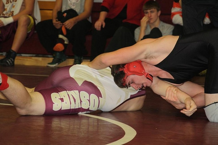 Chris Stobie wrestles Forrest Cross. Sotbie won by a pin in 2:15.