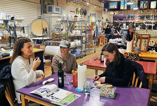 From left, Niki MacLean, Maggie Eisenbarth and Amy Chisholm share ideas and advice at Stumptown Art Studio on Wednesday. MacLean started an online social network for mothers called Whitefish Moms for Moms after moving to the area this summer, giving the women a supportive venue on the Web.