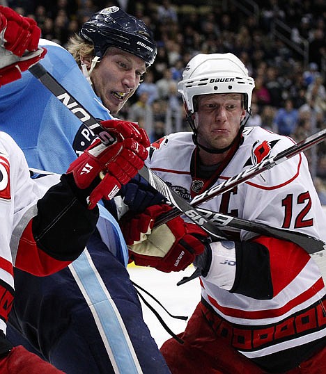 &lt;p&gt;Pittsburgh's Jordan Staal, left, and his brother, Carolina's Eric Staal (12) battle in the corner during the third period Saturday at Pittsburgh.&lt;/p&gt;