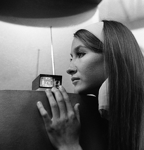 &lt;p&gt;A model looks at the Sinclair Micro vision set, a pocket size television set designed by Clive Sinclair that can go anywhere and claims to be the world's smallest TV, at Earls Court, London, in September 1966. The rectangular face plate of the cathode tube has a diagonal measurement of two inches.&lt;/p&gt;