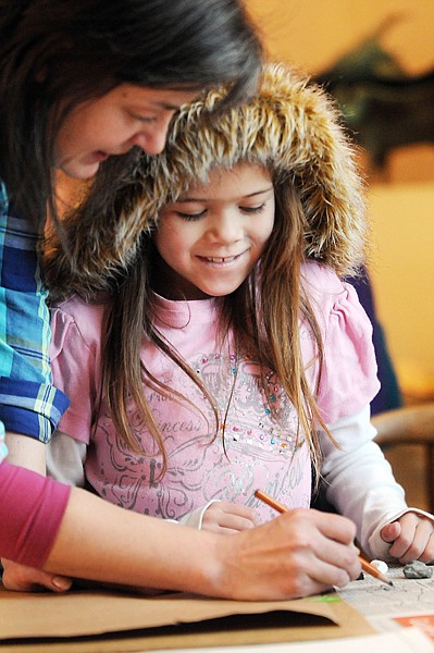 <p>Artist Joli Hailey helps Samantha Kinniburgh, 7, of Kalispell,
with her drawing of a white tiger Saturday afternoon at StillRiver
Art Studio in Kalipsell.</p>