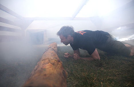 &lt;p&gt;A participant takes part in a trial run of the new tear gas obstacle for Tough Mudder in Vale Lake, near Temecula, Calif., Nov. 1, 2014.&lt;/p&gt;