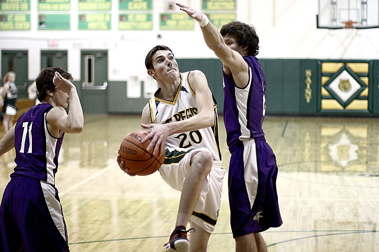 &lt;p&gt;St. Regis senior Spur Hill goes up for a basket against Charlo.&lt;/p&gt;