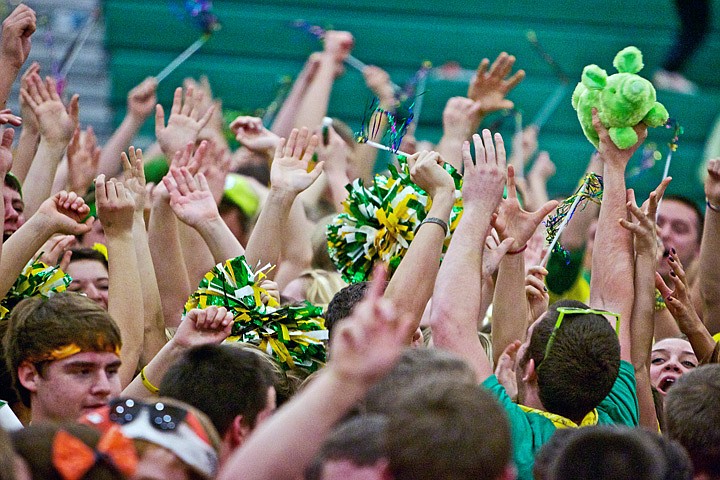 &lt;p&gt;JEROME A. POLLOS/Press Lakeland High students hoist their piggish trophy while they celebrate Tuesday after winning the Prairie Pig school spirit competition against Post Falls High.&lt;/p&gt;