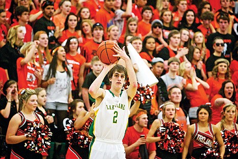 &lt;p&gt;JEROME A. POLLOS/Press Lakeland High's Aaron Spencer pulls up a shot with the Post Falls High student crowd behind him during the second half of the Prairie Pig game Tuesday in Rathdrum.&lt;/p&gt;