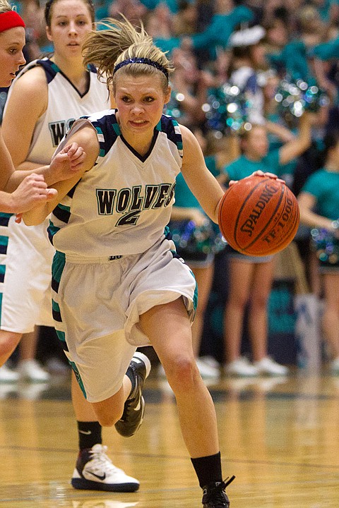 <p>Sydney Butler sports her signature "look" while driving to the basket in a game earlier this month.</p>