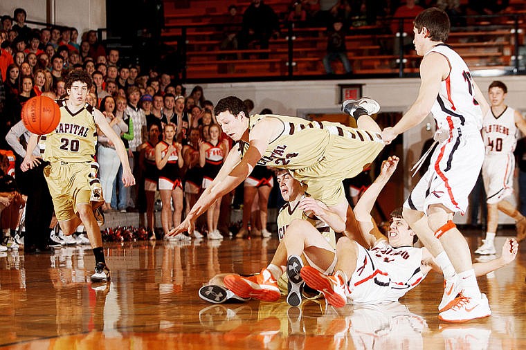 &lt;p&gt;Flathead's Garth West (bottom) and Helena Capital&#146;s Levi Dawes (24) collide Friday night during Flathead's home loss.&lt;/p&gt;