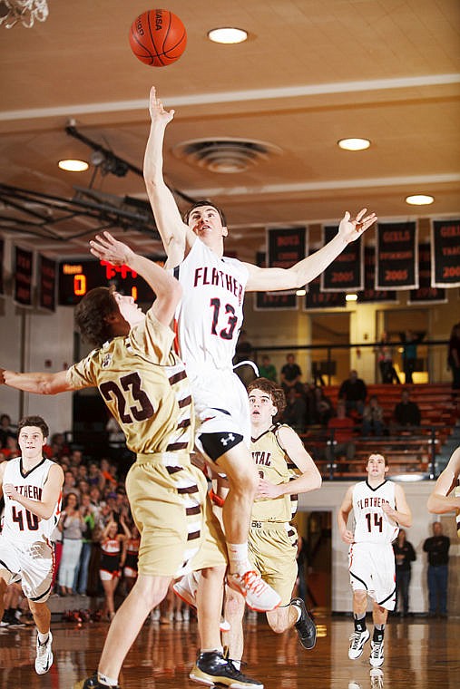 &lt;p&gt;Flathead's Blaine Newman (13) puts up a shot over Helena Capital&#146;s Levi Dawes (23) Friday night during Western AA basketball action at Flathead High School.&#160;&lt;/p&gt;