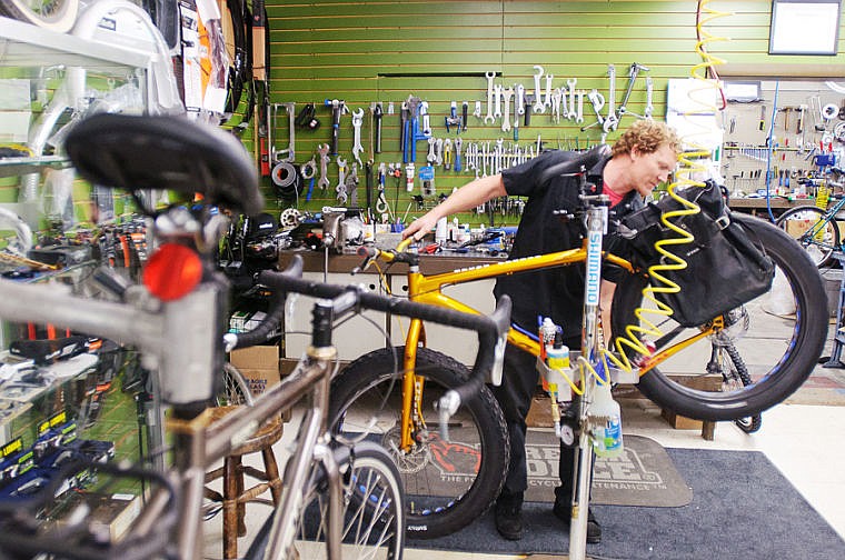 &lt;p&gt;Wheaton's Cycle mechanic Mark Christensen tunes up a winter touring bike Thursday afternoon at the Kalispell bicycle shop. Jan. 23, 2014 in Kalispell, Montana. (Patrick Cote/Daily Inter Lake)&lt;/p&gt;