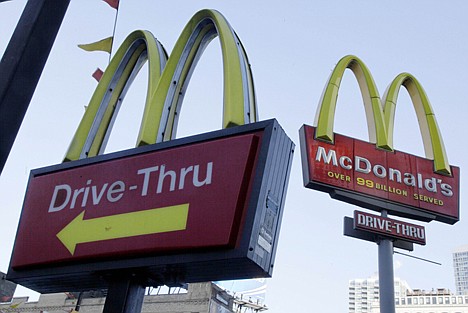 &lt;p&gt;In this Dec. 20, 2010, photo, McDonald's signs sprout from the restaurant's parking lot in New York. McDonald's said Monday its fourth-quarter net income rose 2 percent as it brought in more customers with its McRib sandwich and an addition to its successful McCafe coffee lineup.&lt;/p&gt;