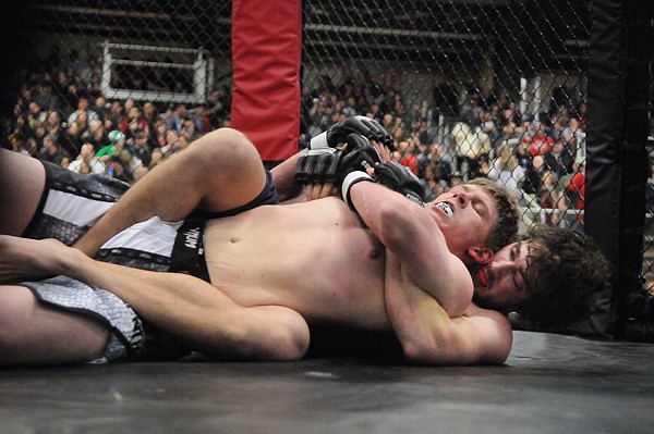 &lt;p&gt;Jeremy Sanderson, top, of Deer Lodge, fights with Joel Ballard
of Kalispell on Saturday night at the Fight Force Kalispell Kombat
at Majestic Valley Arena. Ballard won the bout in 1:07 of the
second round with a submission due to strikes.&lt;/p&gt;