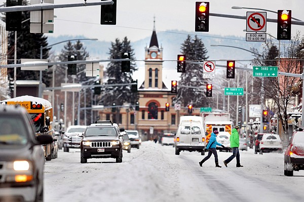 &lt;p&gt;Pedestrians make their way across Main Street in downtown
Kalispell Friday morning.&lt;/p&gt;