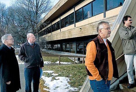 As part of an effort to find long-term solutions to the county's building needs, Flathead County Commissioners and County Administrator Mike Pence took a tour of the Flathead National Forest's supervisor's office Wednesday. From left are Dale Lauman, Pence, Gary Hall and building owner Scott Hollinger. The Forest Service will soon be vacating the office and county officials are eyeing the building as a possible option for expanding county administration offices. Hollinger is selling the 36,000 square-foot building for $2.7 million. Karen Nichols/Daily Inter Lake