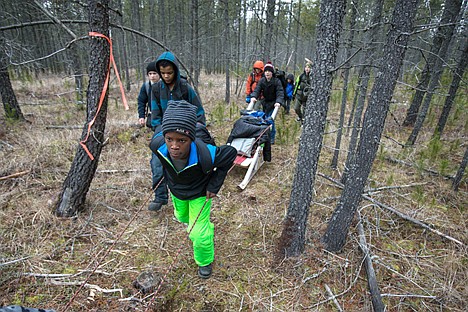 &lt;p&gt;Trey McArthur, 12, a Boy Scout with Coeur d&#146;Alene Troop 209, helps pull the troop&#146;s Klondike sled through a wooded area just East of Silverwood Theme Park Saturday during the Klondike Derby. Scouts were required to demonstrate their skills in survival, teamwork and preparedness in order to earn points to compete with other Inland Northwest troops.&lt;/p&gt;