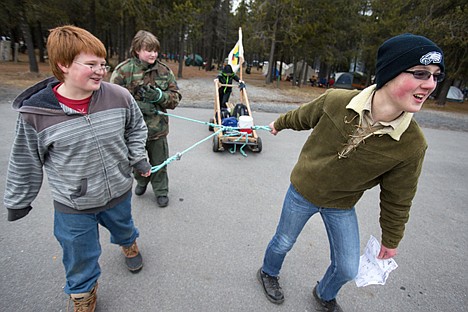 &lt;p&gt;Rathdrum Boy Scouts Gordon McKibben, 14, right, Davan Tancre, 11, left, and Noah Miller, 13, pull their Klondike sled through the Silverwood Theme Park campground parking lot Saturday with Ben McNeil, 13, pushing from the back. Troop 216 from Rathdrum called themselves the Atomic Platapi.&lt;/p&gt;