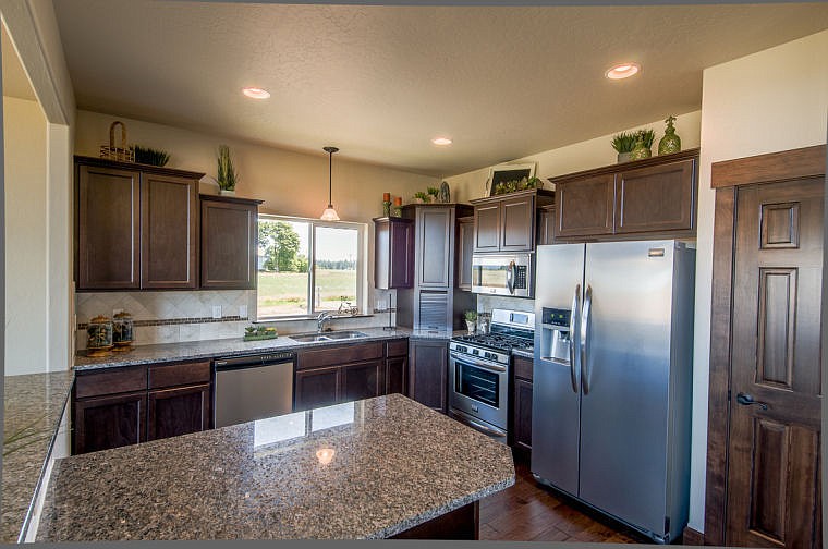 &lt;p&gt;Crown molding, granite countertops and stainless steel appliances add to the elegance of the luxurious kitchen.&lt;/p&gt;