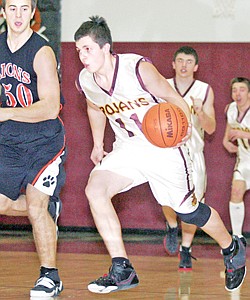 &lt;p&gt;Sophomore guard Gabe Hickman speeds past Alex Shmelev on a fast
break in first quarter action vs Eureka.&lt;/p&gt;