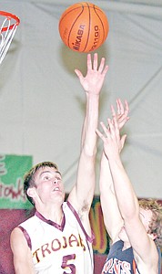 &lt;p&gt;Ryan Rayson stretches for an offensive rebound in first quarter
action vs. Eureka.&lt;/p&gt;