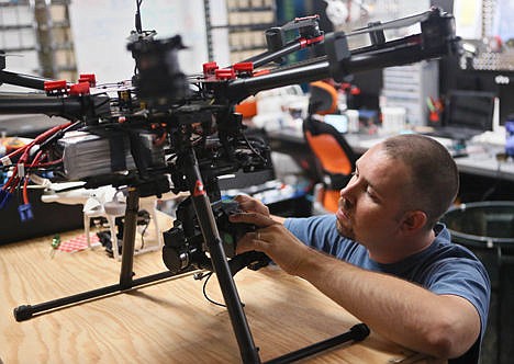 &lt;p&gt;Greg Ledford, director of UAV Technology at Atlanta Hobby, prepares a DJI Technology S1000 professional octocopter for flight, in Cumming, Ga., on July 10, 2014.&#160;&lt;/p&gt;