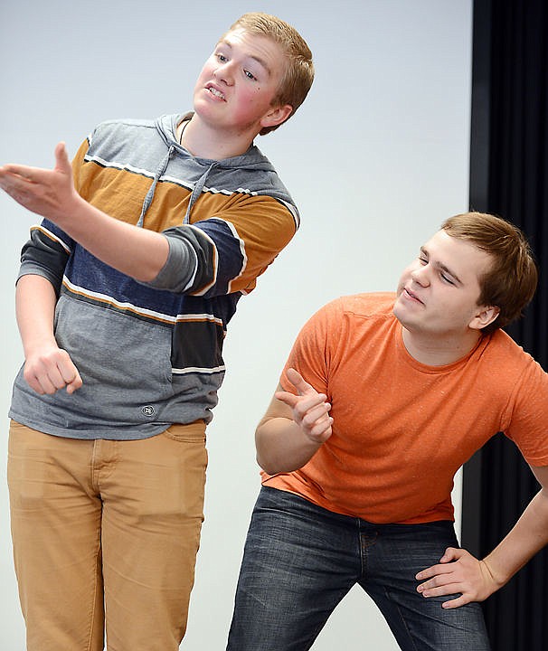 <p><strong>Wyatt Dykhuizen</strong>, left, and Parker Kouns, both juniors, practice their Duo Interpretation routine on Tuesday at Flathead High School. The pair won their event Saturday at the Class AA state meet and Flathead claimed the team championship.</p>