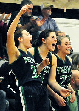 &lt;p&gt;The Wolfpack's Taylor Salonen (3), Nikki Krueger (21), and Anna Schrade (23) celebrate from the bench after a basket in the final minutes of their victory against Flathead. (Aaric Bryan/Daily Inter Lake)&lt;/p&gt;