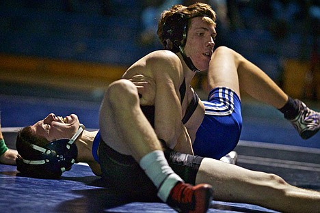 &lt;p&gt;Coeur d'Alene High's Steve Price gives a grimace of pain as Post Falls High's Mitch Crain applies pressure to his arm and shoulder in the 120-pound match Crain won by decision Thursday.&lt;/p&gt;