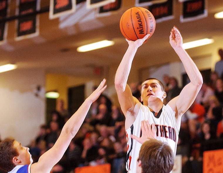 &lt;p&gt;Flathead senior Blaine Newman shoots over two defenders Friday night during the matchup between Flathead and Columbia Falls at Flathead High School. Jan. 24, 2014 in Kalispell, Montana. (Patrick Cote/Daily Inter Lake)&lt;/p&gt;