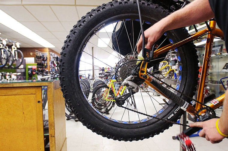 &lt;p&gt;Wheaton's Cycle mechanic Mark Christensen oils the chain a winter touring bike Thursday afternoon at the Kalispell bicycle shop. Jan. 23, 2014 in Kalispell, Montana. (Patrick Cote/Daily Inter Lake)&lt;/p&gt;