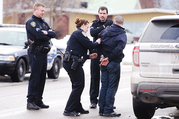 &lt;p&gt;A man is taken into custody after Kalispell Police Department responded to a vehicle versus building crash Friday afternoon at Posh 125 Salon in Kalispell. Jan. 24, 2014 in Kalispell, Montana. (Patrick Cote/Daily Inter Lake)&lt;/p&gt;