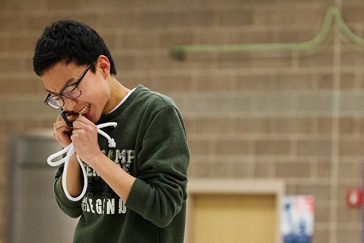 &lt;p&gt;SHAWN GUST/Press Yunuk Cho, 15, bites on a rope Wednesday during a magic act during Korean-American Friendship Night at Woodland Middle School in Coeur d'Alene. 25 Korean students have been hosted by families as part of the Geoje Sister School Program.&lt;/p&gt;