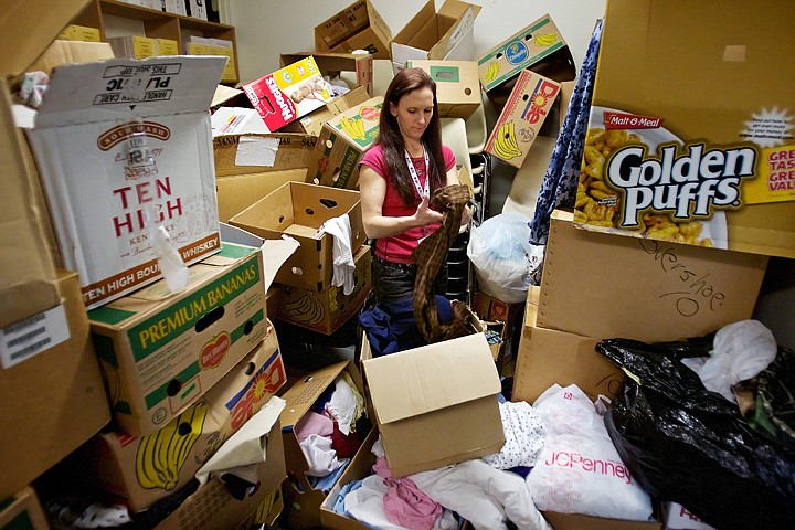 &lt;p&gt;Jamie Loftis, a volunteer with Project Homeless Connect, searches through the boxes full of donated clothing to offer to those in need before the start of Thursday's event.&lt;/p&gt;