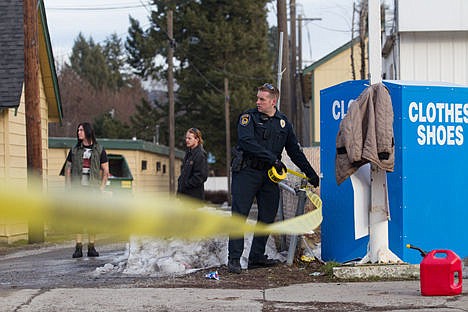 &lt;p&gt;Coeur d'Alene Police Officer Anders Tenney, blocks off a section of 15th street after a pipe bomb scare on Tuesday at the Budget Saver Motel Annex.&lt;/p&gt;